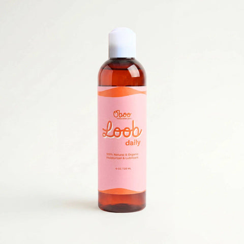A 4 oz amber bottle of Oboo Loob daily personal moisturizer with a white cap and a pink label, set against a plain off-white background.