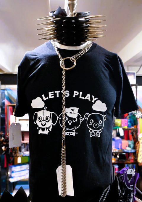 Black t-shirt with graphic design and text on a mannequin in a store setting