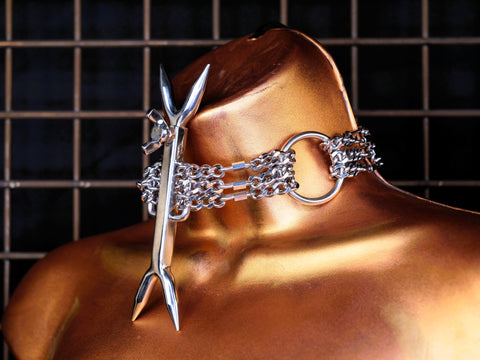 Heretic's fork on a locking steel chain collar