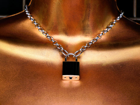 Necklace with a padlock pendant on a bronze background