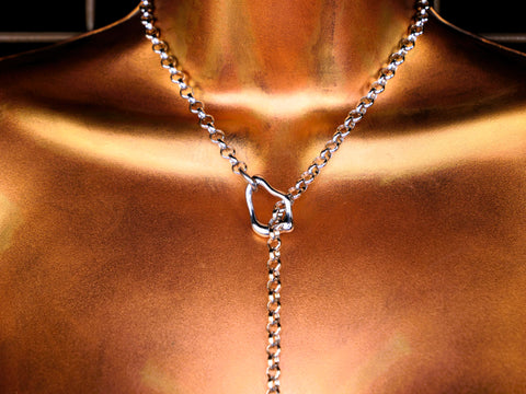 abstract stainless steel slip chain necklace  on bronze torso