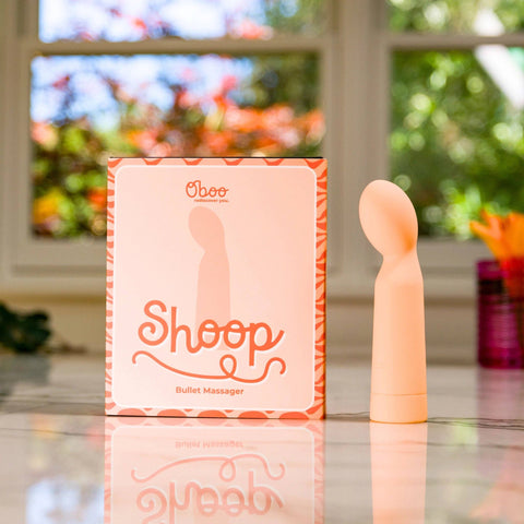 Shoop bullet massager with packaging on a reflective surface